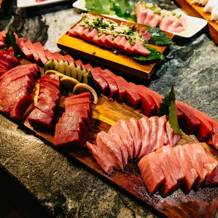 Boards of bluefin on stone.