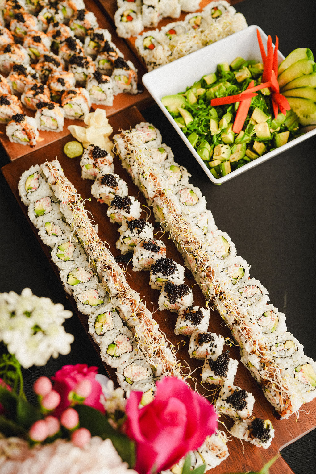 Hand rolls finished with caviar.