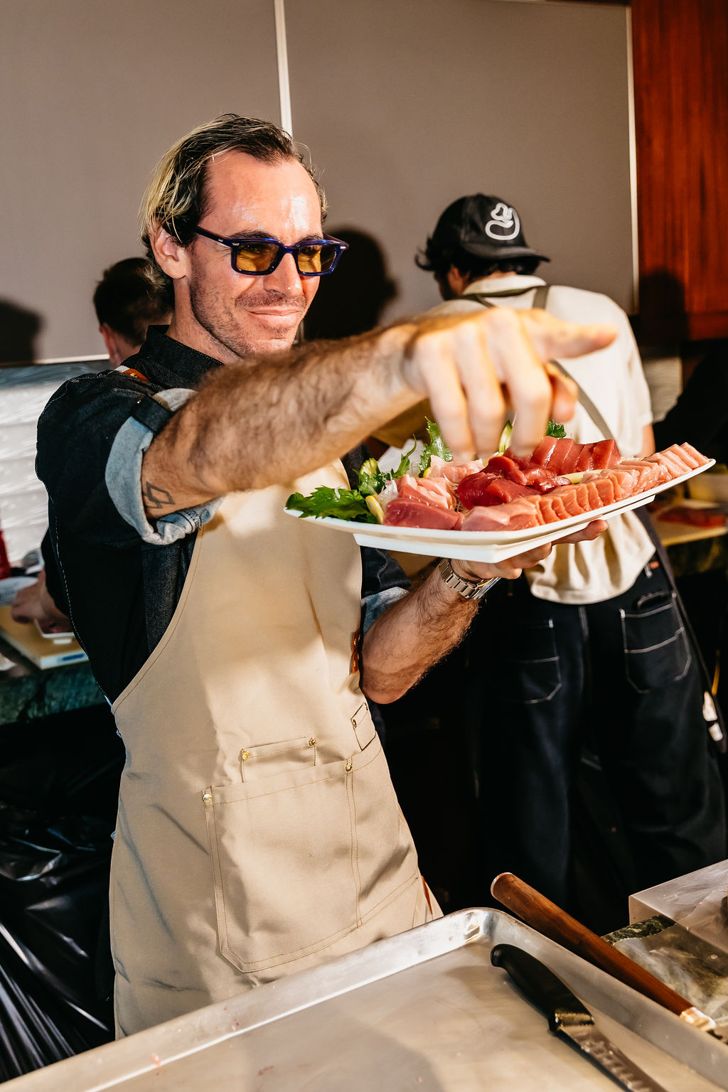 Brendon Jasso presenting sashimi.